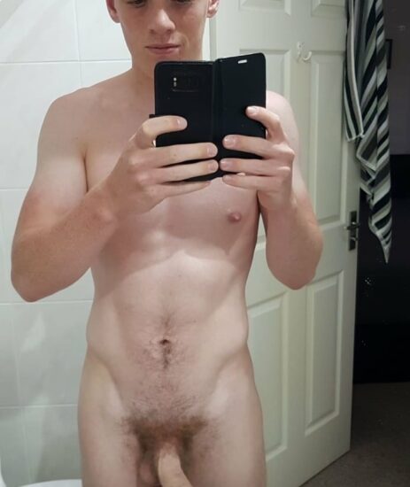 Nude boy taking a selfie